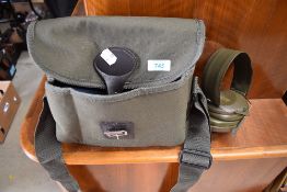 A canvas cartridge bag and ear defenders