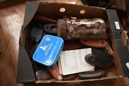A box of gun butts and jar of cartridge wadding