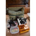 A large selection of fishing tackle including two spinning reels in nice canvas fishing bag with two