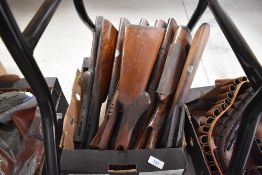 A box of used gunstock and forestocks
