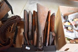 A box of used gunstocks and forestocks