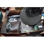 A box containing weather proof hats and knife sheaths