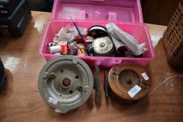 Two large vintage reels and an assortment of fly tying equipment.