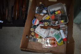 A box of assorted fishing tackle including line / ledger weights.