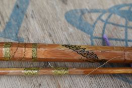 A 5'4' split cane Japanese fly rod with spare tip and reel