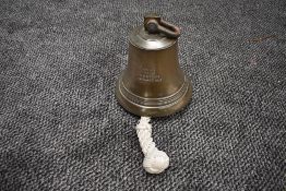 A Brass Ships Bell, inscribed 'Metal from HMS Tiger Jutland 1916', 23cm high x 18cm diameter, having