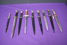 A collection of 9 miniature German Bayonets, six are miniature WW2 Dress Bayonets, one miniature