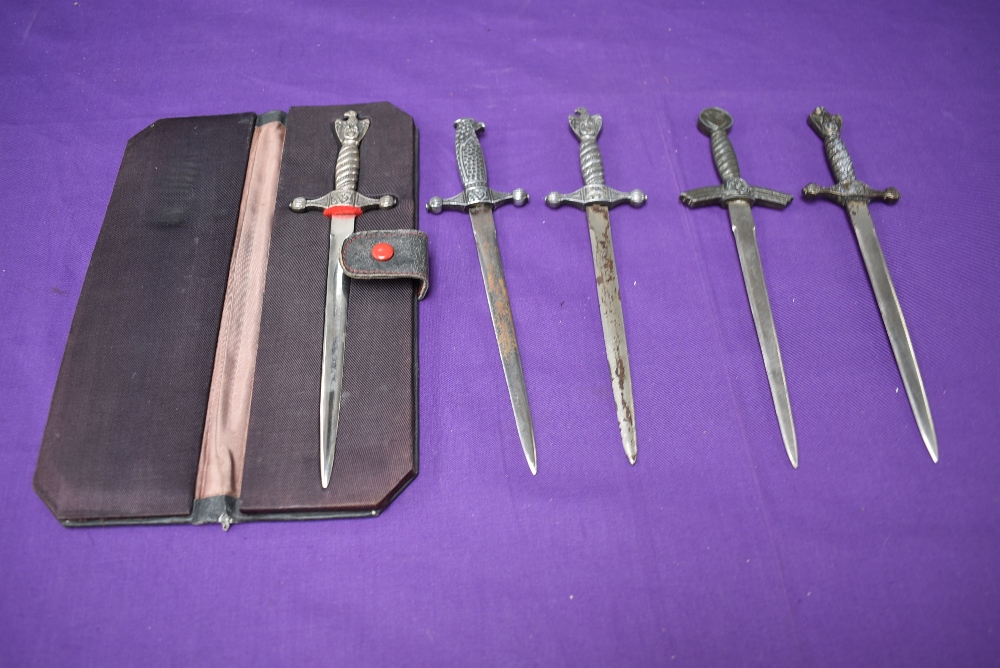 Five German style miniature Daggers including Kreigsmarine, one part cased, total lengths approx