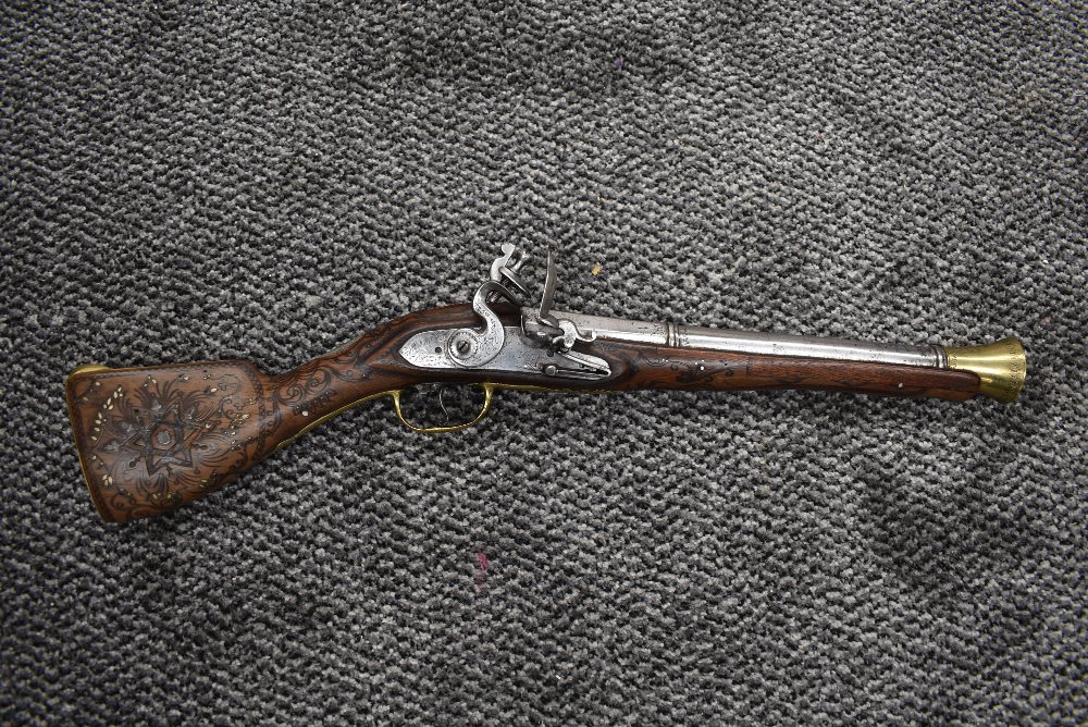 An early possibly Turkish Flintlock Blunderbuss Pistol, decorated brass trigger guard and stock