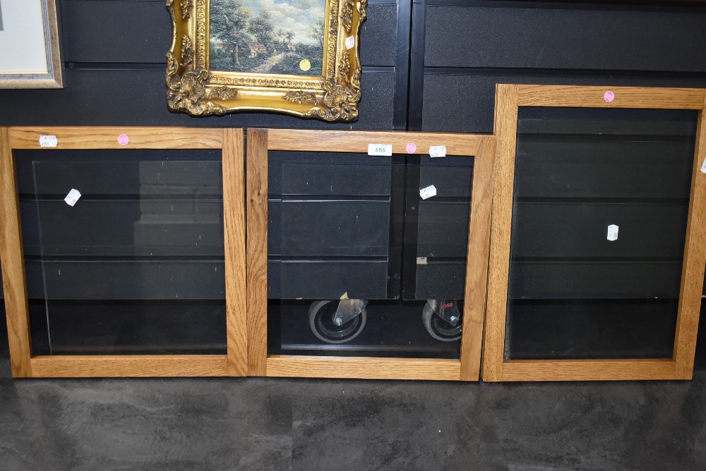 Three oak framed and glazed frames