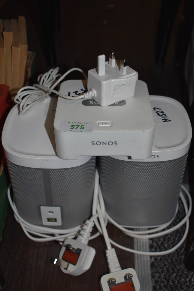A modern Sonos unit and two Sonos Play 1 speaker units