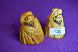 A pair of scrimshaw style carved figures possibly marine ivory in an oriental style having good