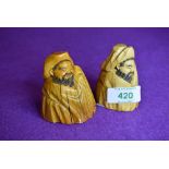 A pair of scrimshaw style carved figures possibly marine ivory in an oriental style having good