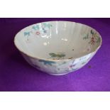 An antique Chinese porcelain punch or slop bowl having hand decorated naturalistic design