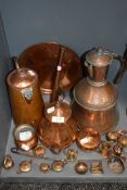 A selection of copper wares including scoop kettle and hunting horn