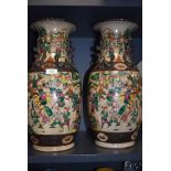 A pair of large floor standing Chinese vase highly decorated with scenes or battle