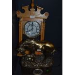 A quartz mantle clock of a horse and foal in a bronze effect and a wooden cased clock