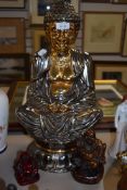 a large figure study of a Tibetan style Buddha sat on lotus leaf approx 46cm tall