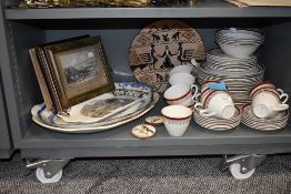 A selection of tea cups and saucers un named having burgundy and gilt detail