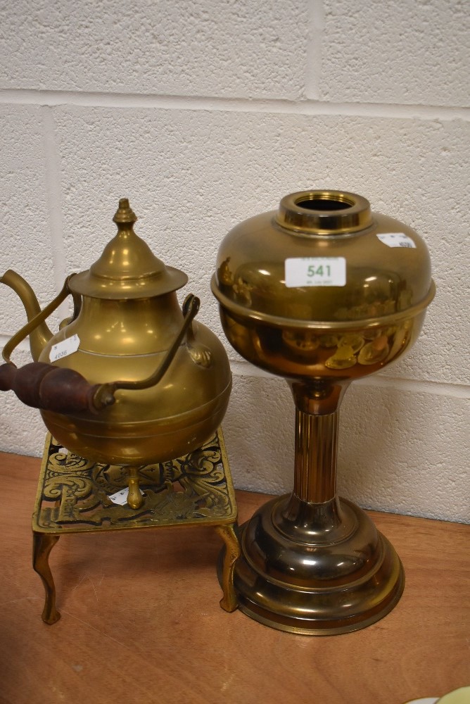 An antique brass cast fire trivet or kettle stand having French coat of arms also kettle and lamp