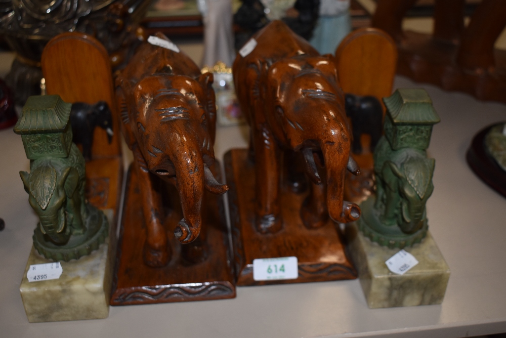 A selection of ethnic tribal items including book ends and pair of elephant figures