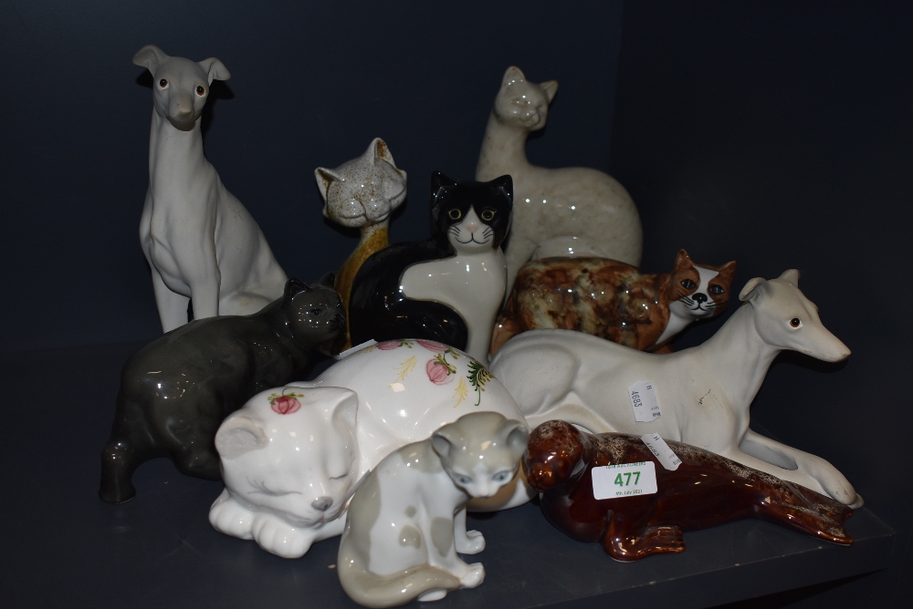 A selection of dog and cat figures and figurines including Grey hound and tabby cat