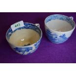 Two early English transfer tea cups one being tin glazed with unusual scene fisherman and water