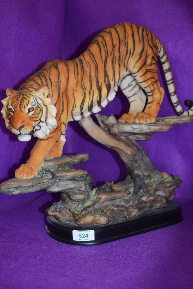 A large figure study of an Indian Tiger ready to pounce