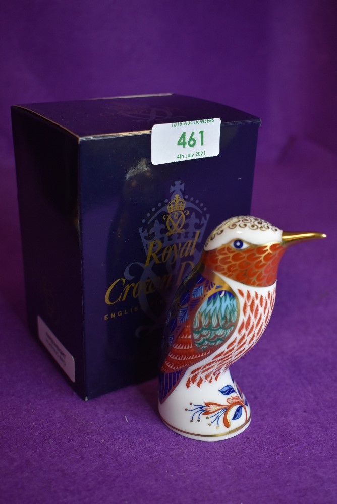 A ceramic Royal Crown Derby paper weight or figure of a Humming Bird having gold stopper and box