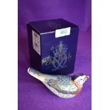 A ceramic Royal Crown Derby paper weight or figure of a Bluebird having gold stopper and box