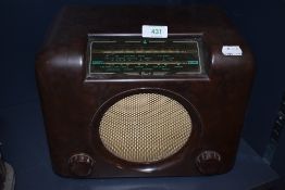 A vintage Art Deco styled bakelite radio by Bush the DAC 90 with glass and case in great condition