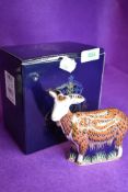 A ceramic Royal Crown Derby paper weight or figure of a Nanny Goat having gold stopper and box