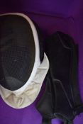 A vintage fencing mask by Leon Paul and a pair of leather arm guards