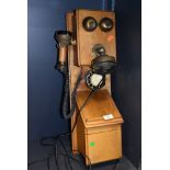 A reproduction wall mounted telephone made by Astral