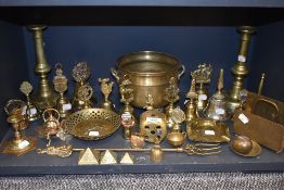 A selection of brass wares including candle sticks letter rack and bells