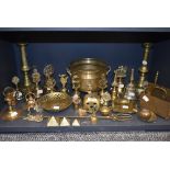 A selection of brass wares including candle sticks letter rack and bells