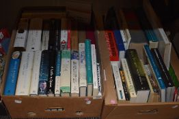 Two containers of hard and paper back reference and text books including Melvyn Bragg Credo and