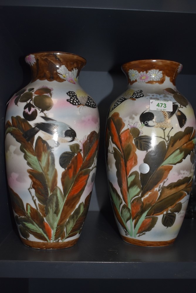 A pair of antique Chinese or Japanese porcelain vase having bird and butterfly decoration