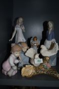 A selection of Spanish figures including Nao flower girl and similar dove birds