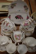 A selection of tea cups saucers and cake plates having floral designs