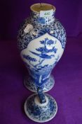 A hand decorated Chinese export porcelain lidded vase depicting bird and foliage 33cm tall