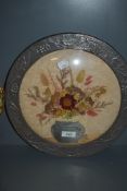 An arts and crafts style embossed metal framed dried flower display having convex glass front.