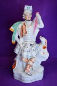 A large size Staffordshire flat back figure of a Scottish Highlander 39cm high