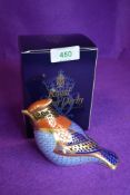 A ceramic Royal Crown Derby paper weight or figure of a wax wing having silver stopper and box