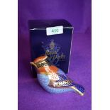 A ceramic Royal Crown Derby paper weight or figure of a wax wing having silver stopper and box