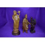 Three hand carved Chinese figures including lady atop lotus leaf