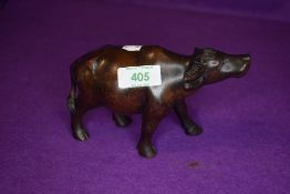 An ethnic hard wood hand carved figure of an water buffalo
