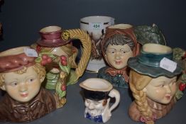 A selection of character styled jugs and mugs being hand painted