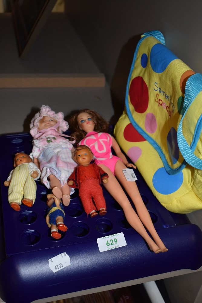 A selection of small size dolls and figures including Barbie style