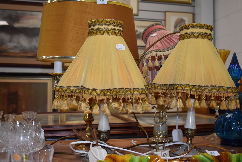 A selection of vintage ormolu effect lamps including pair and large candle stick style